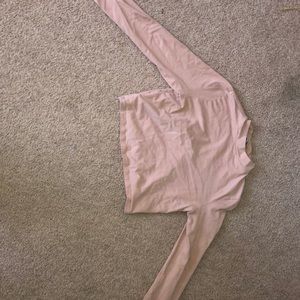 cropped light long sleeved pink shirt